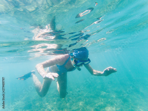woman snorkeling in clear tropical waters - active holiday © Melinda Nagy