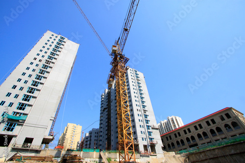 Unfinished high-rise buildings and tower crane