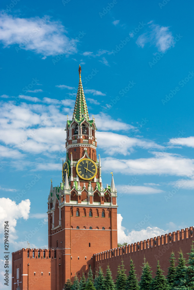 View of the Spasskaya Tower of the Moscow Kremlin against a cloudy sky.
