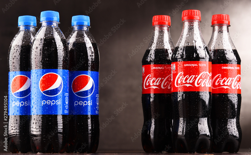 Bottles of carbonated soft drink Coca Cola and Pepsi Photos | Adobe Stock