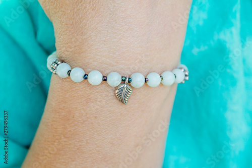 Mineral amazonite beads bracelet with leaf pendant on female wrist
