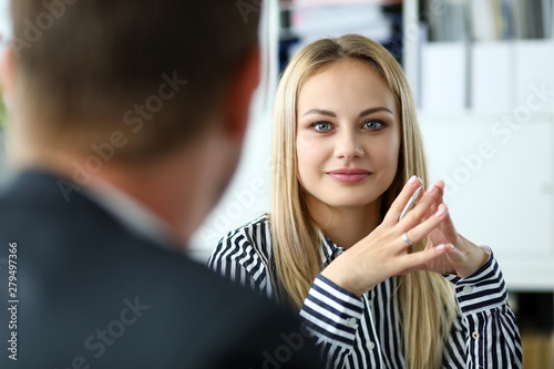 Beautiful blonde female person sitting at workplace portrait