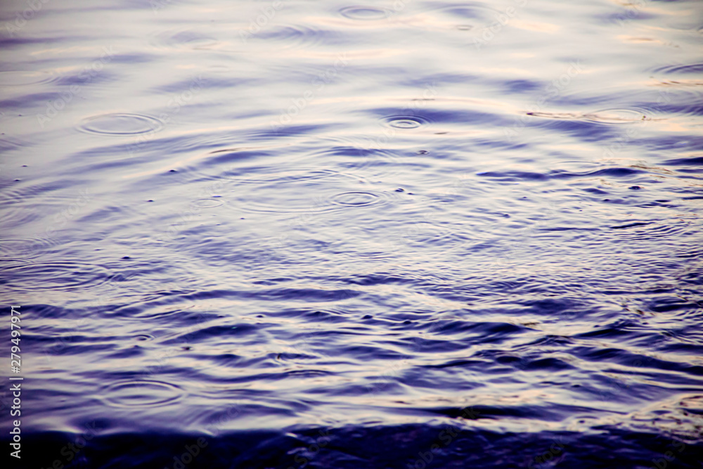 Blur background of rain drop on water surface, Raindrops start drop from the sky before rain, Rainy season Blur background of rain drop on water surface, Raindrops start drop from the sky before rain, Rainy season