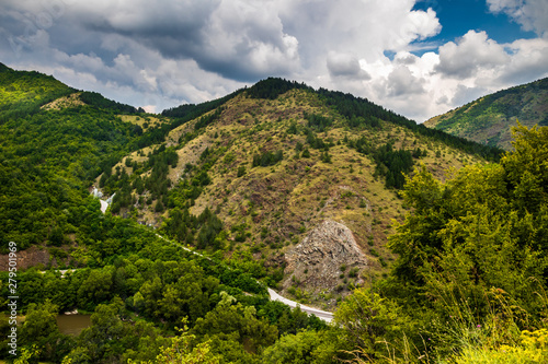 Mountain and forest, cloudy day with dark clouds. Near the Ibar river and Maglic castle in Serbia photo