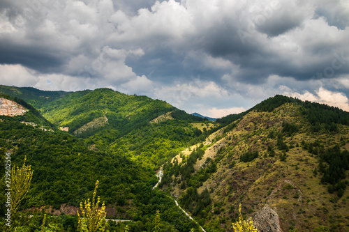 Mountain and forest, cloudy day with dark clouds. Near the Ibar river and Maglic castle in Serbia photo