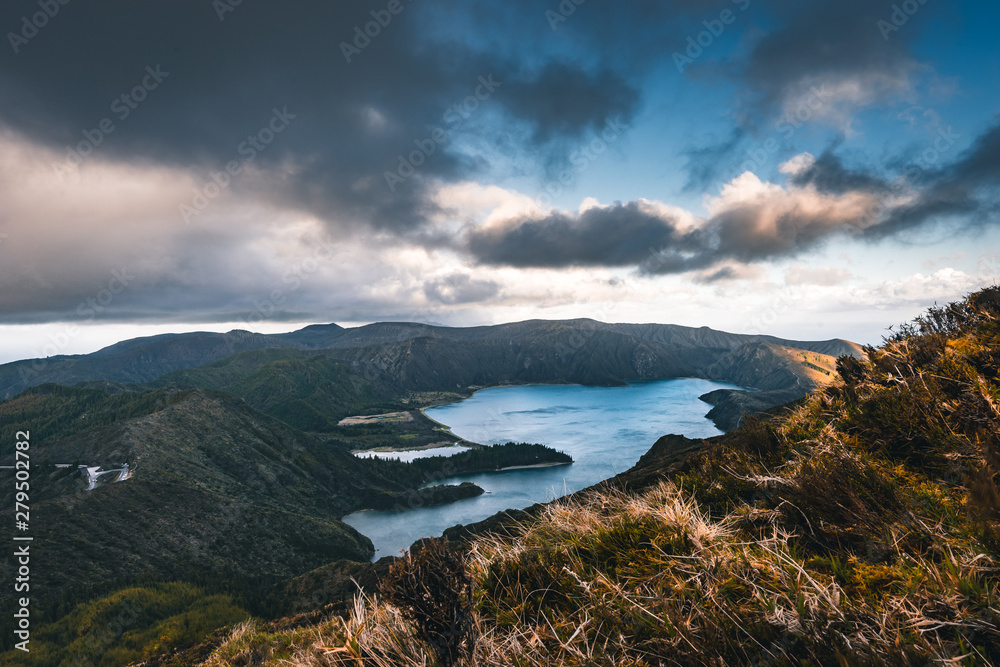 Beautiful panoramic view of Lagoa do Fogo, Lake of Fire, in Sao Miguel Island, Azores, Portugal. Sunny day with blue sky and clouds.