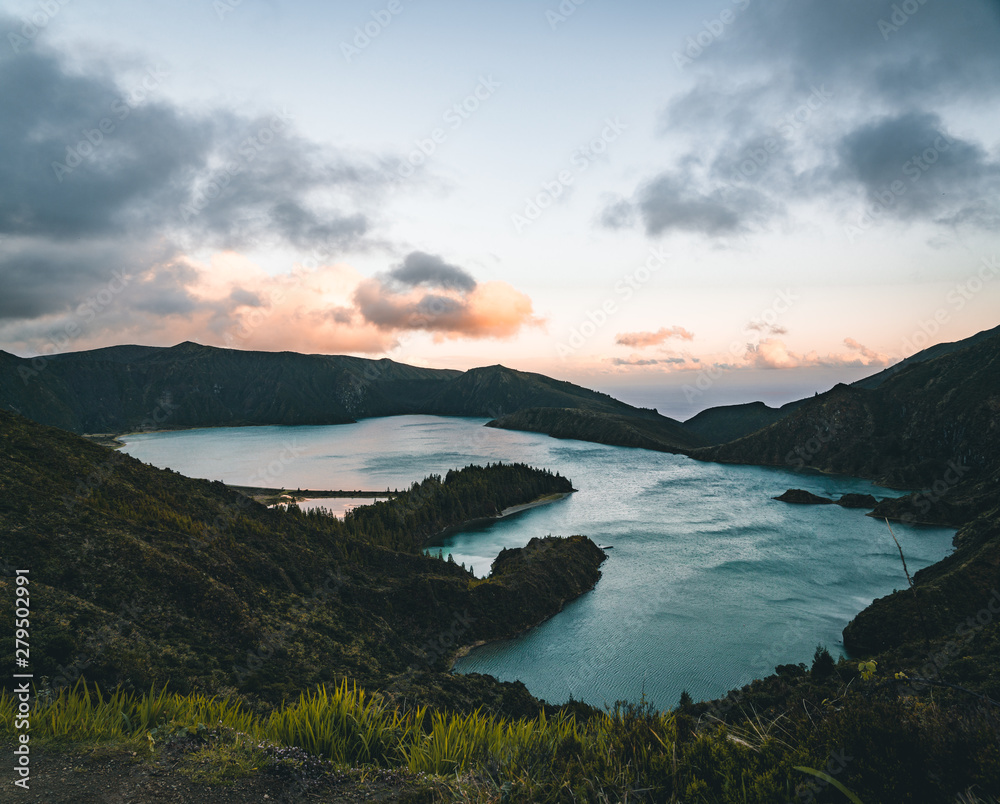 Beautiful panoramic view of Lagoa do Fogo, Lake of Fire, in Sao Miguel Island, Azores, Portugal. Sunny day with blue sky and clouds.