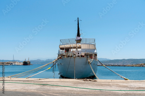 Kissamos Port, Kastelli, Crete, Greece. June 2019. An old ferry in a poor state of repair alongside and named Atlantis and Atlantic. photo