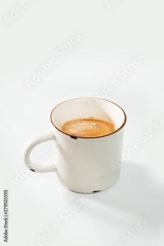 coffee cup in the morning light on white background
