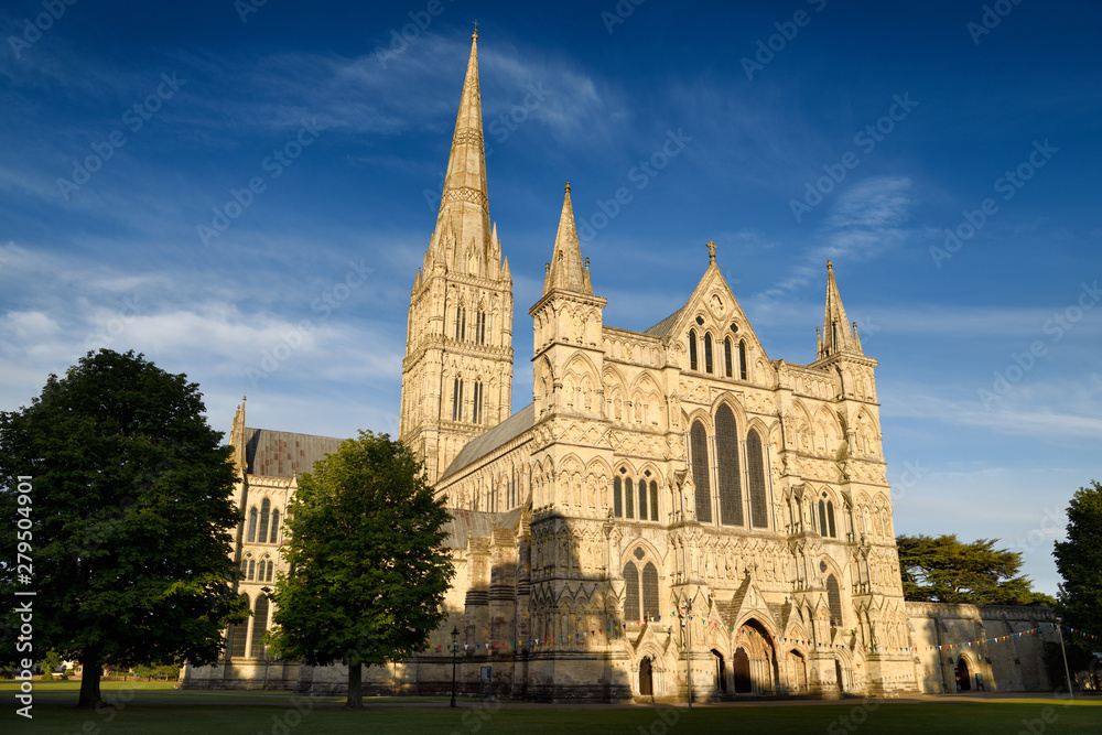 Great West Front facade of Salisbury Cathedral in late evening light in Salisbury England