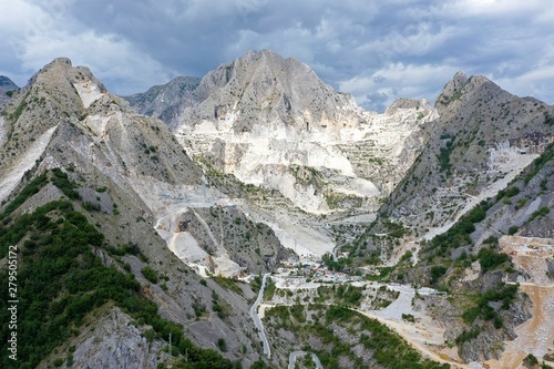 Aerial view of mountain of stone and marble quarries in the regional natural park of the Apuan Alps located in the Apennines in Tuscany  Massa Carrara Italy. Open pit mine