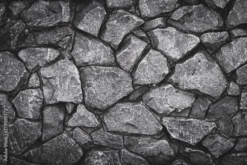 Gray pattern of stone wall background. Abstract gray grunge texture, rocky road. Grey granite surface, floor. Old stone wall, brick masonry. Rock textured.