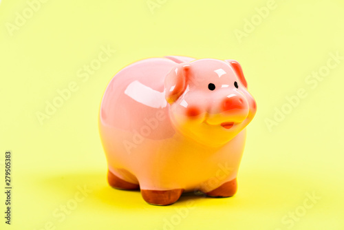 Money is a power. financial problem. money saving. piggy bank on yellow background. income management. planning budget. Piggy bank with coin. saving or accumulation of money, investment