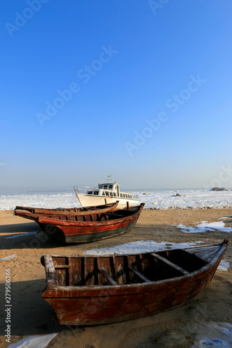 Cruise ships and wooden boats on the beach