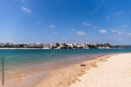 Fototapeta Naklejka Na Ścianę i Meble -  View of the Vila Nova de Mil Fontes town from the praia das Furnas beach on the other side of the Mira river