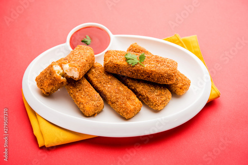 Kurkuri paneer fingers or pakora/pakoda snacks also known as Crispy Cottage Cheese Bars, served with tomato ketchup as a starter. selective focus