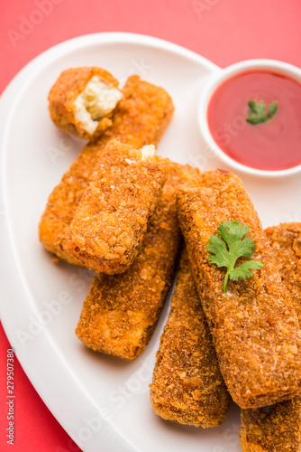 Kurkuri paneer fingers or pakora/pakoda snacks also known as Crispy Cottage Cheese Bars, served with tomato ketchup as a starter. selective focus