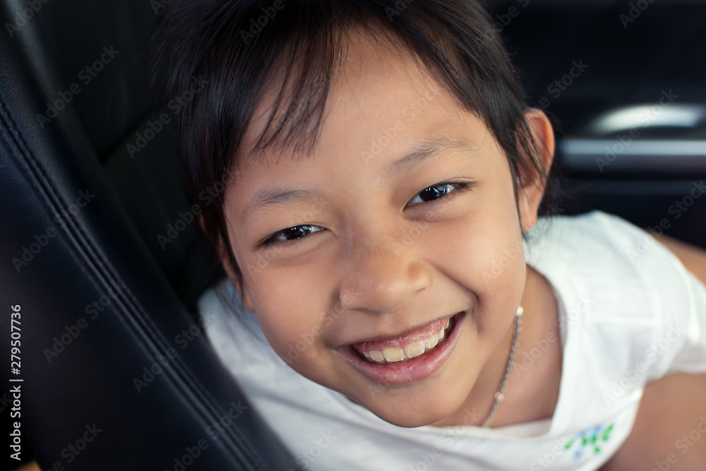Asian little girl smiling in car with happy and fun. Asian little girl smiling in car with happy and fun.