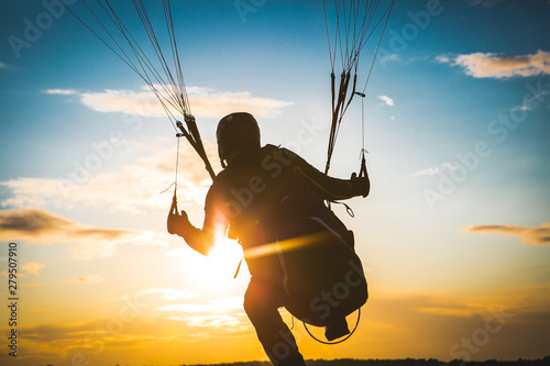 Paraglider flying. Sunset. Take off. Top view