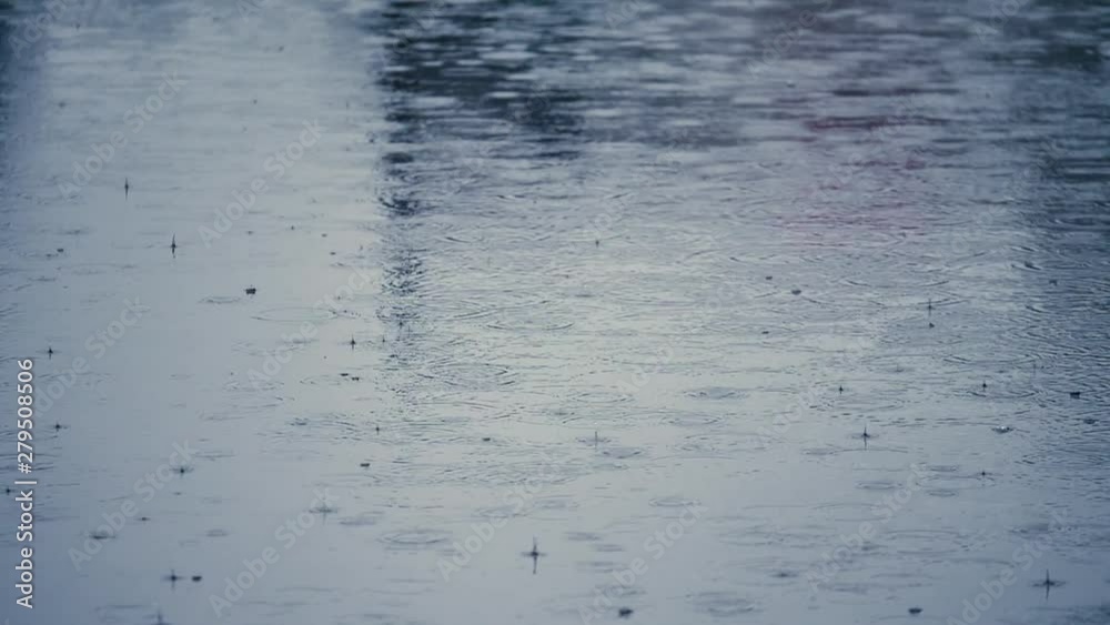 Rippled rain drops in super slow motion. Puddle on asphalt. Nobody in frame. Rippled rain drops in super slow motion. Puddle on asphalt. Nobody in frame.