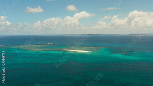 Tropical islands in turquoise lagoon and coral reef water, aerial view. Summer and travel vacation concept. Siargao,Philippines.