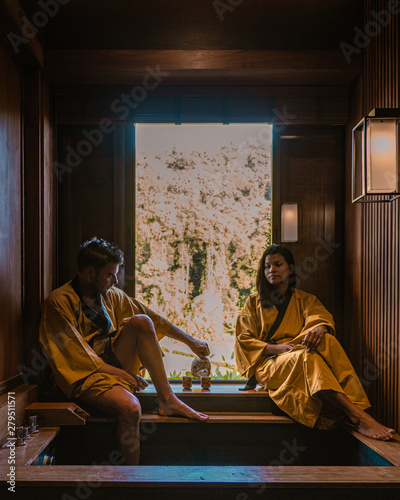 Japanese Onsen Spa, couple men and woman drinking thee Onsen Spa, japanese onsen bath in Thailand 