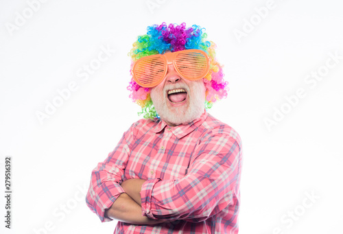 Crazy man in playful mood. anniversary holiday. happy birthday. corporate party. happy man with beard. Celebration retirement. mature man in colorful wig and party glasses. Time to have some fun