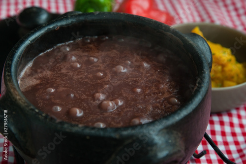 A pan filled with hot brazilians beans