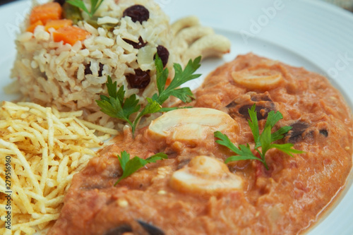 Vegan eggplant stroganoff with rice and potato sticks