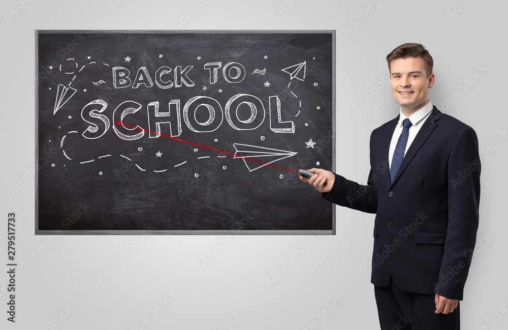 Handsome young teacher with laser pointer teaching Handsome young teacher with laser pointer teaching