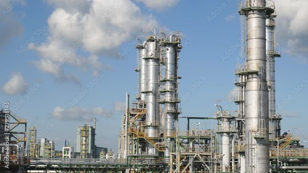Refinery tower in oil and gas petroleum plant with blue sky , Panning video and no body scene Refinery tower in oil and gas petroleum plant with blue sky , Panning video and no body scene