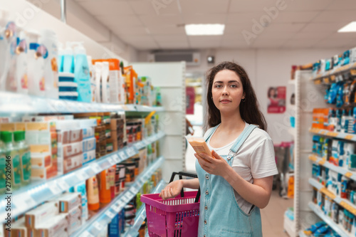 Shopping trip. Young beautiful selects the hair in the beauty supply store Free Download Shopping trip. Young beautiful selects the hair in the beauty supply store - GFXLoad