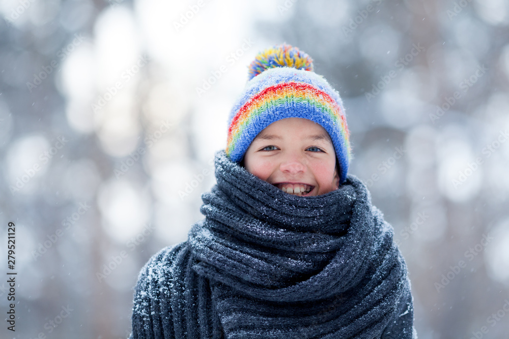 Portrait of happy boy in black coat for walk in winter park, outdoor Portrait of happy boy in black coat for walk in winter park, outdoor