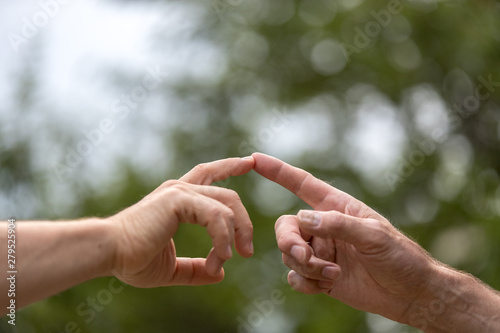 two hands touching, two men touch their finger, concept the Global Gender Gap Report