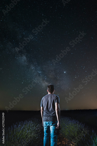 Man looking at the stars. Seeing the beauty of the Milky Way.