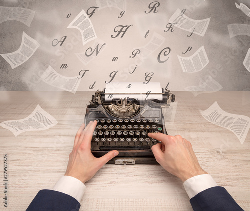 First person perspective hand typewriting with flying documents around