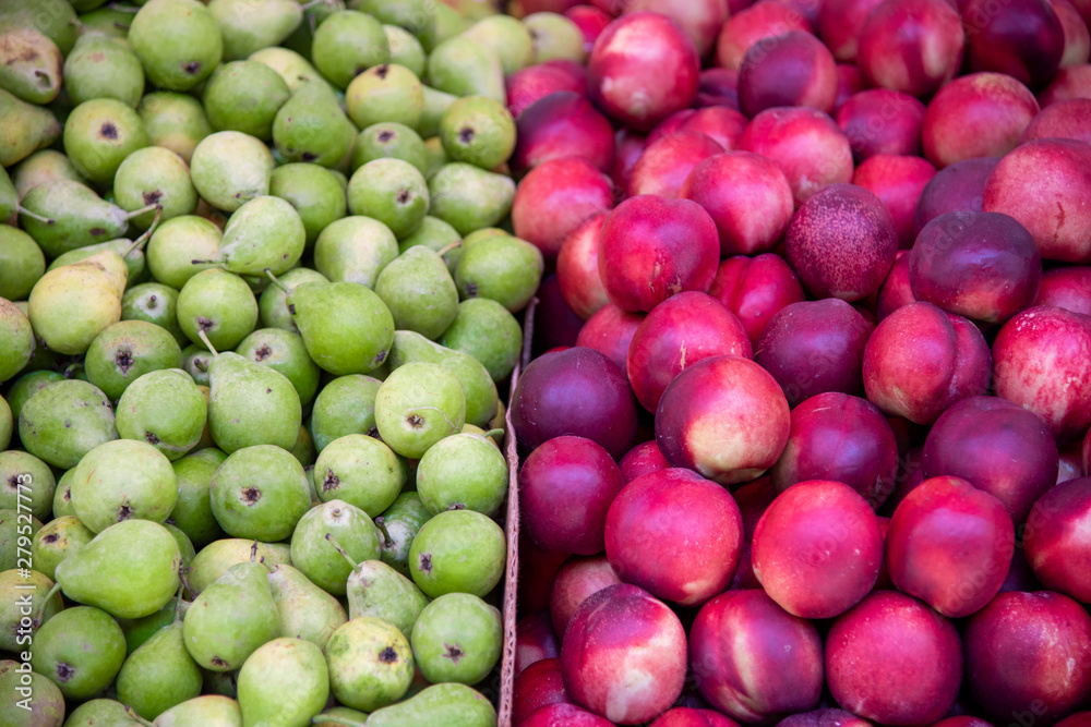 Close-Up Of Nectarine Peaches and Pears for sale at market stall. Carmel Market, Tel Aviv, Israel Close-Up Of Nectarine Peaches and Pears for sale at market stall. Carmel Market, Tel Aviv, Israel