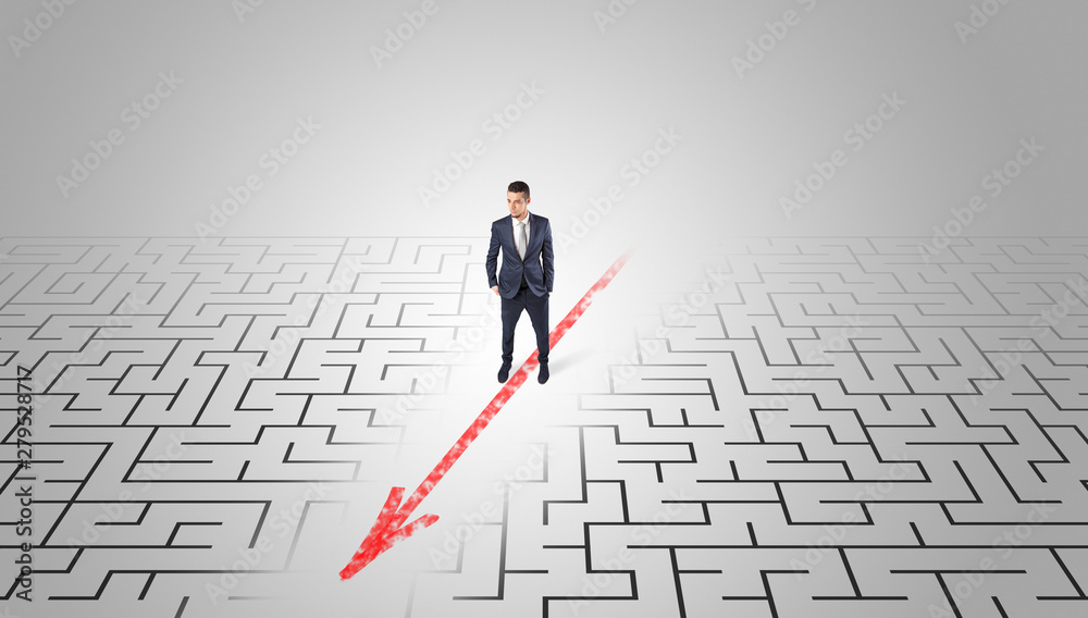Businessman going through the maze with red arrow Businessman going through the maze with red arrow