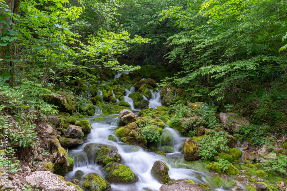 Waterfall in the deep forest on mountain. Waterfall in the deep forest on mountain.