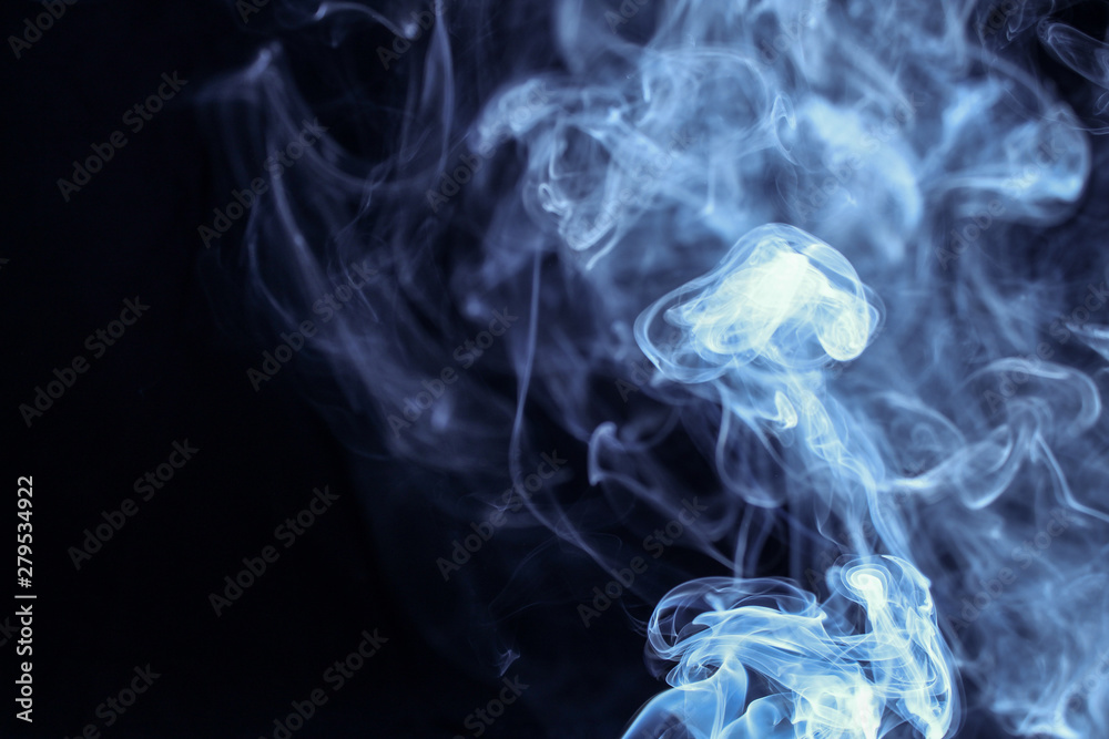 Fototapeta premium abstract blue smoke isolated on black background