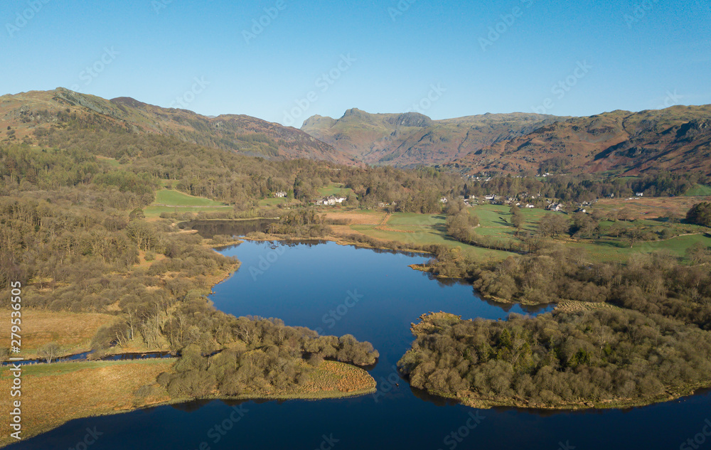 Aerial view and vista of the Langdale Pikes from above Elterwater in the glorious English Lake District