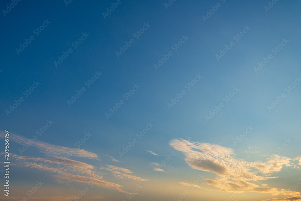 Beautiful golden sunny view of deep blue sky and Altocumulus cloud during evening sunset time. 