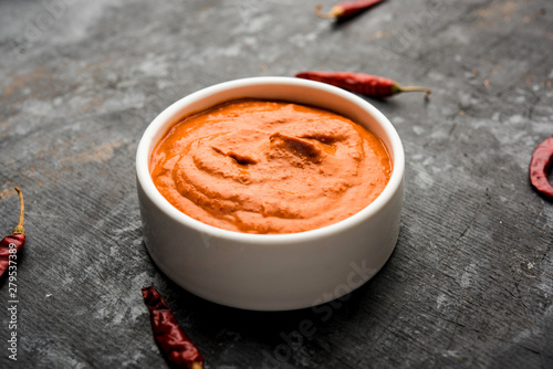 Peri Peri Sauce in a bowl, originally from portugal, it's a hot sauce made using piri piri or African bird's eye chillies.  selective focus photo