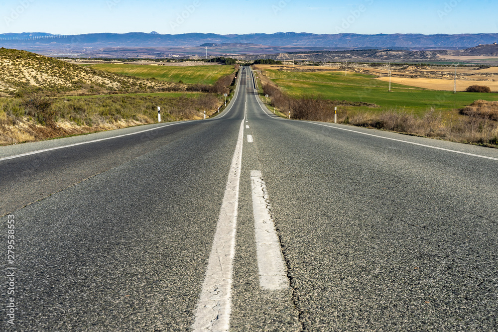 An empty road in the scenic landscape of Navarre region, Spain