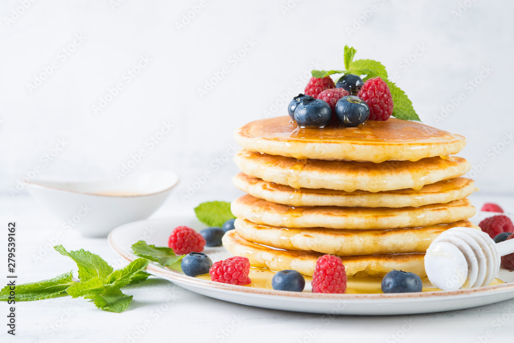 American pancakes with fresh berries and honey American pancakes with fresh berries and honey