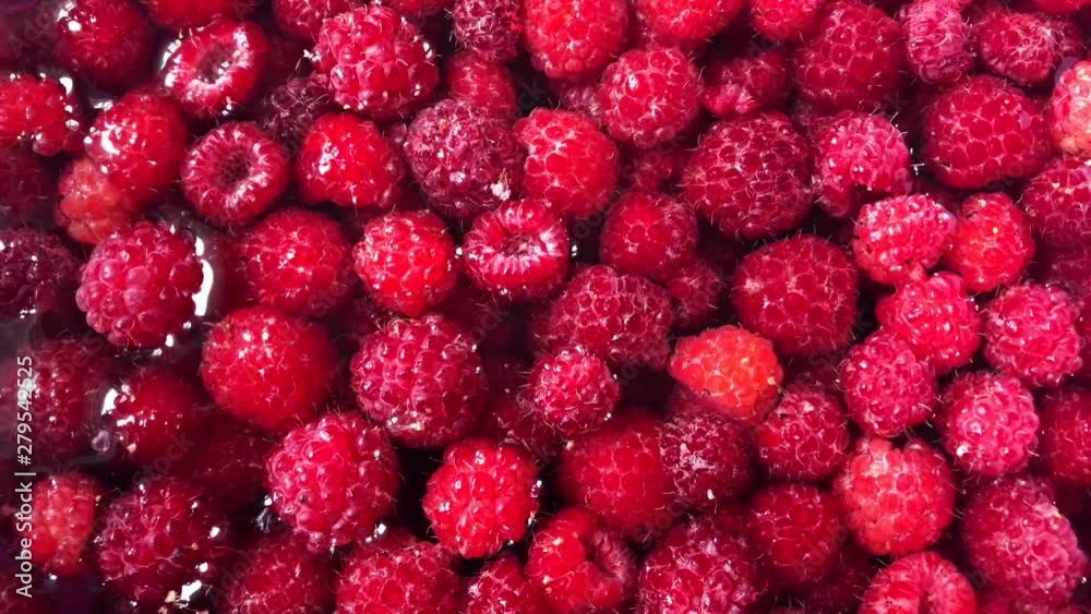 Red raspberries in a cup of water. Red raspberries in a cup of water.