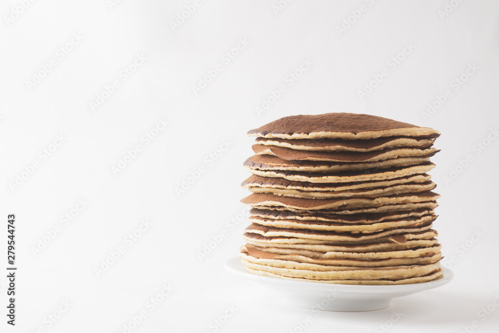 Pancakes on a saucer on a white background Pancakes on a saucer on a white background