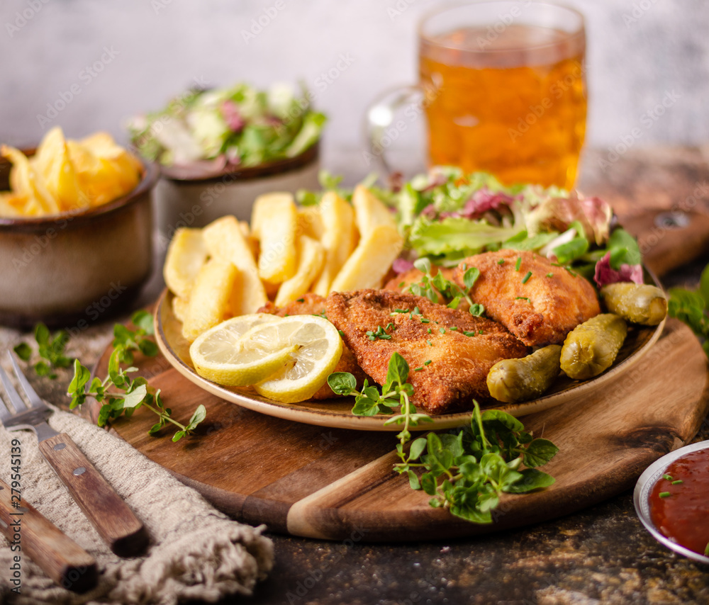 Original schnitzel with homemade french fries Original schnitzel with homemade french fries