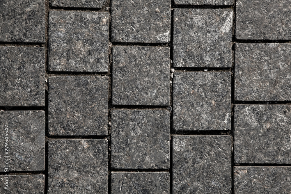 Abstract background of gray cobblestone pavement,close-up, top view. Abstract background of gray cobblestone pavement,close-up, top view.