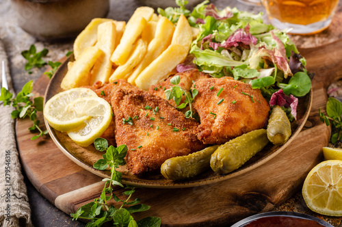 Canvas Print Original schnitzel with homemade french fries